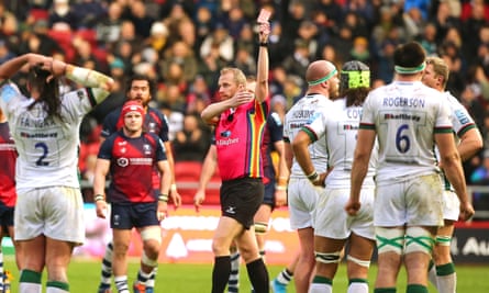 Wayne Barnes brandishes a red card.