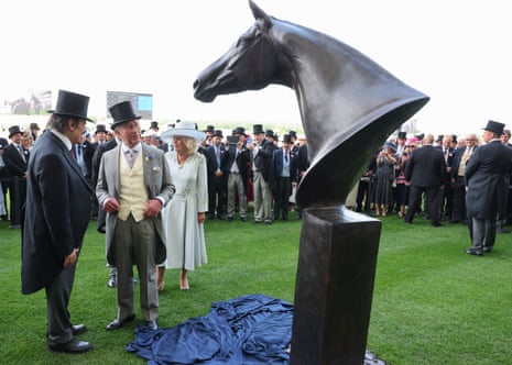 King Charles III and Queen Camilla unveil a statue to the horse Enable at Royal Ascot.