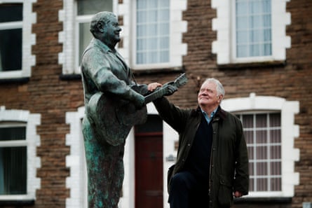 Max Boyce stands next to his statue in Glynneath.