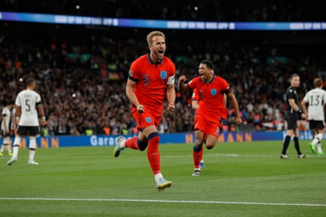 Harry Kane celebrates scoring for England to make it 3-2.