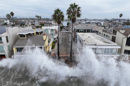 waves of water hitting houses