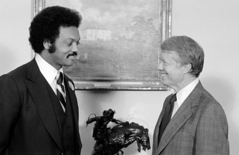 Former Democratic President Jimmy Carter speaks with Jesse Jackson at the White House in Washington in 1979.