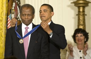 President Barack Obama presents Poitier with the Presidential Medal of Freedom, the highest civilian award, at the White House in Washington DC on 12 August 2009