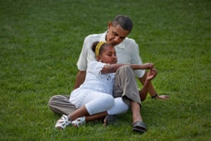 Obama sits with daughter Sasha during celebrations for his 49th birthday