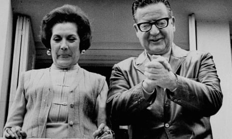 Salvador Allende and his wife, Hortensia Bussi de Allende, smile at reporters from the window of their home in Santiago, 5 September 1970.