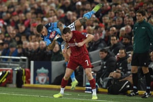 Napoli’s Giovanni Di Lorenzo clashes with Liverpool’s James Milner.