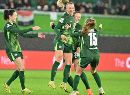 Wolfsburg’s Ella Peddemors celebrates aft scoring their 2nd extremity against Manchester United