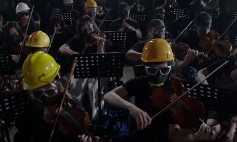 A clip from the YouTube video, showing the orchestra performing the tune in full protest battledress. 