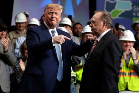 a man pointing at another man