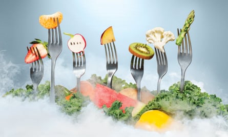 Illustration of a row of forks with various fruits and vegetables.