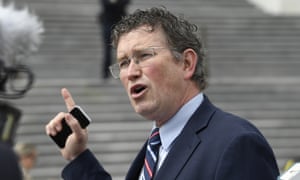 Rep. Thomas Massie, R-Ky., talks to reporters before leaving Capitol Hill in Washington, Friday, March 27, 2020.