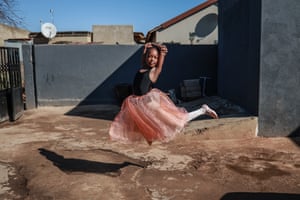 a girl in a tutu dances