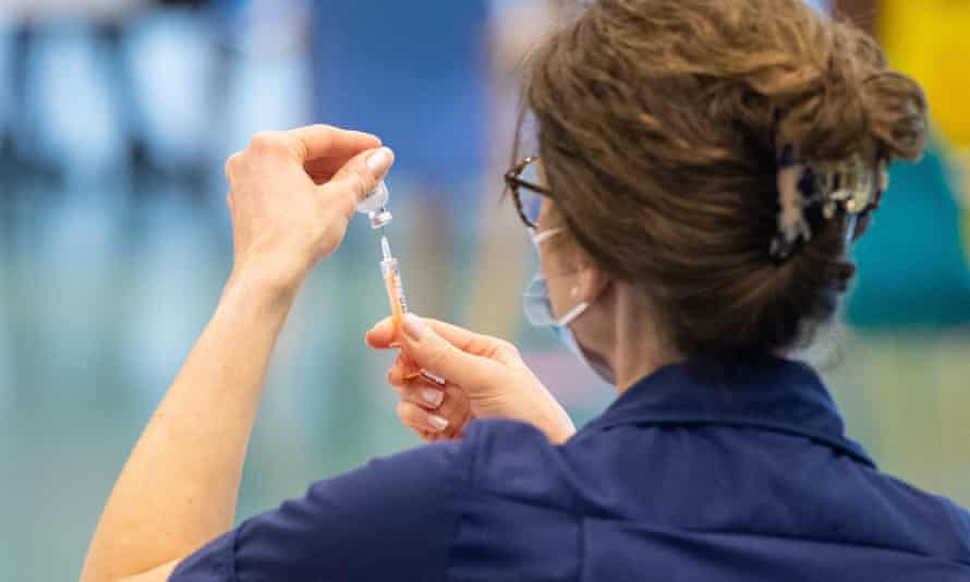 A nurse prepares Oxford/AstraZeneca Covid-19
