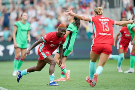 The Kansas City Current forward Temwa Chawinga celebrates with her teammate Haley Hopkins after scoring against Boston Legacy in their NWSL game.