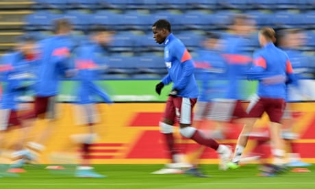 West Ham’s Kurt Zouma (centre) warms up before the game but he was forced out of the squad through illness.