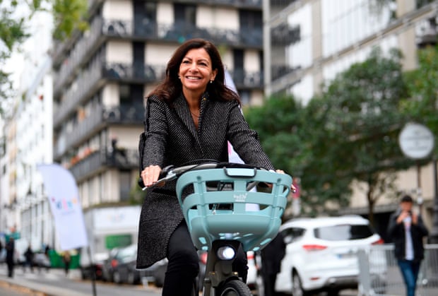 Anne Hidalgo rides one of the new “Velib Metropole” bicycles during their launch in Paris last year