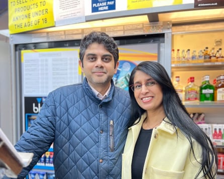 The couple behind the counter of a corner shop