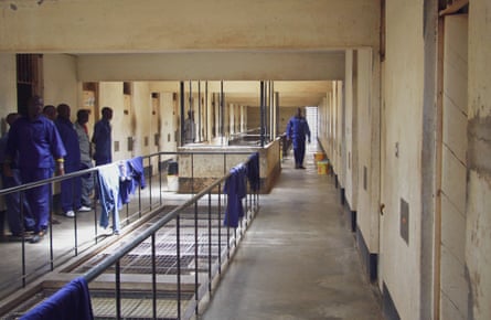 African prisoners in line on the landing of a large jail block