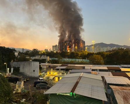 A view from distance of the fire at Wang Fuk Court in Hong Kong’s Tai Po district with flames and thick smoke rising