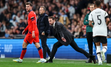 Gareth Southgate stretches to see the action at Wembley