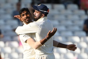 India’s Jasprit Bumrah (L) celebrates with Lokesh Rahul after taking the wicket of Jos Buttler for 106.