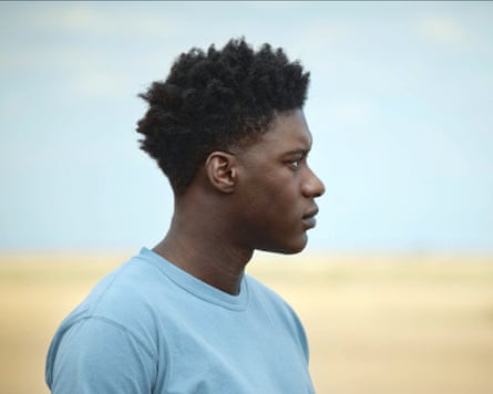 Adewunmi as Femi in the film The Last Tree, looking over to his left.