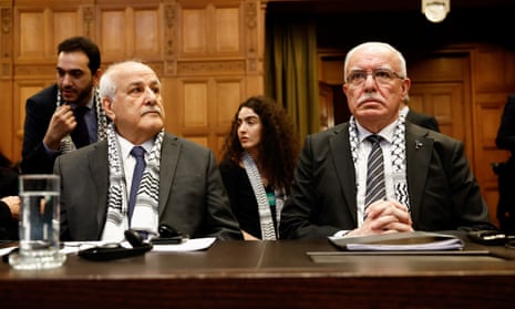 Palestinian Foreign Minister Riyad al-Maliki and Palestinian U.N. envoy Riyad Mansour attend a public hearing held by The International Court of Justice (ICJ).