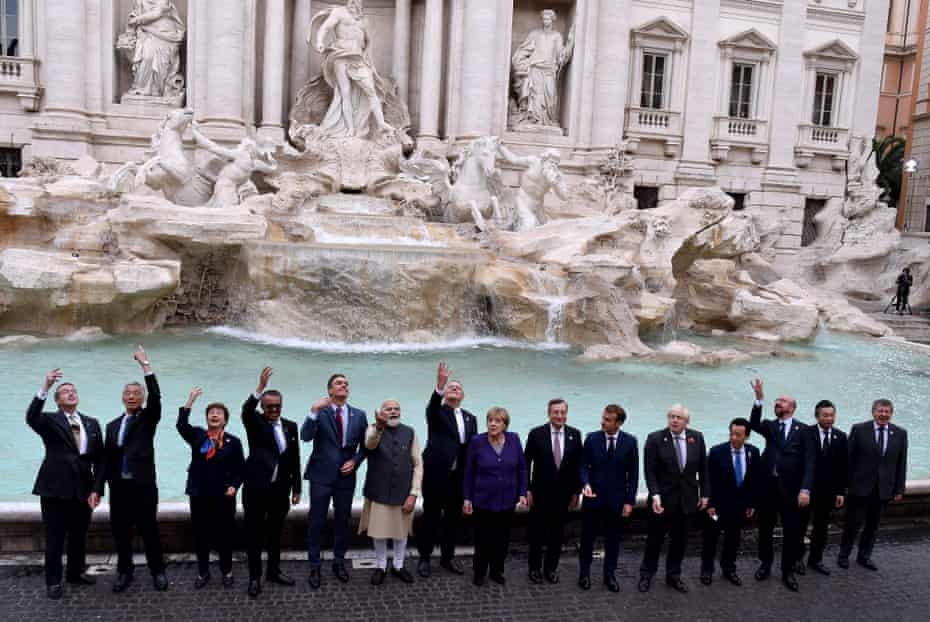 World leaders pose at the Trevi fountain in Rome on the sidelines of the G20 summit