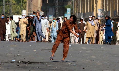 Supporters of former prime minister Imran Khan clash with police in Peshawar after his arrest.