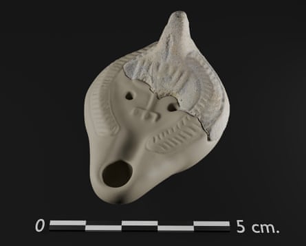 An oil lamp fragment with menorah.