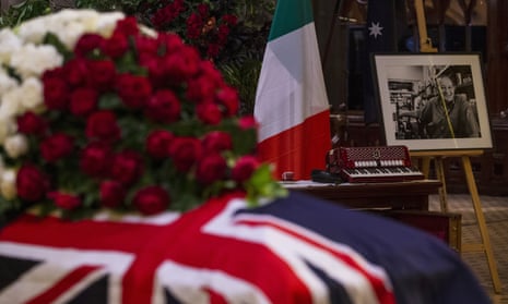 The Italian flag, a photograph and a piano accordion are seen alongside the flag-draped casket of Sisto Malaspina at the Pellegrini’s co-owner’s state funeral at St Patrick’s Cathedral in Melbourne.