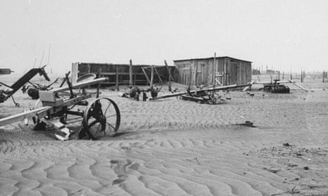 Abandoned farm buildings and machinery in the dust bowl caused by poor farming technique, as seen in May 1935.