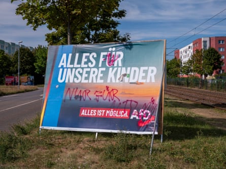 An AfD billboard reads ‘All for our children’.