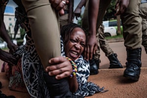Stella Nyanzi, a prominent Ugandan activist and government critic, is arrested by police officers at a May 2020 protest calling for more food distribution by the government during the nationwide Covid lockdown
