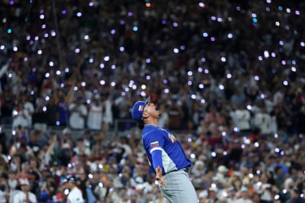 Daniel Palencia of Venezuela celebrates after striking out the final batter to seal the win on Tuesday night.