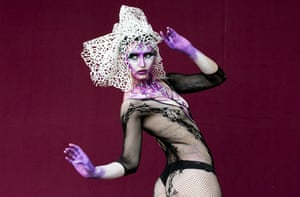 Fishnet body stocking and a head dress