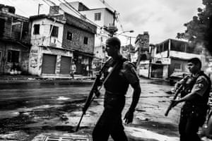 Daily Life, third prize, stories - Sebastien Liste - Citizen journalism in Brazil’s favelas: Police patrol the streets of Vila Aliança, a favela near Complexo do Alemao