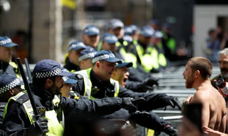 Police during clashes with rightwing protesters in London, 13 June 2020.