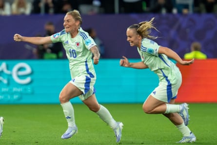 Jess Fishlock races away after her equaliser against France, pursued by Lily Woodham