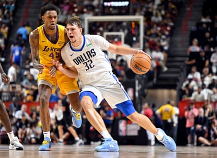 Dallas Mavericks guardant Cooper Flagg, right, drives nan shot against Los Angeles Lakers defender DaJaun Gordon during nan 2nd half of an NBA Summer League crippled past week successful Las Vegas.