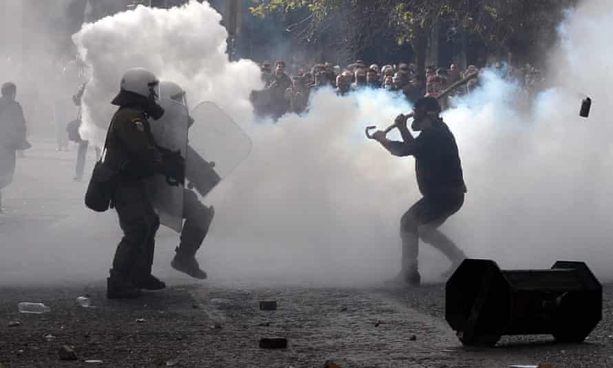 Farmers clash with police surrounded by tear gas