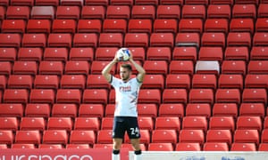 Luton’s Rhys Norrington-Davies in front of an empty stand at Barnsley last Saturday. The EFL believes fans could safely return to stadiums.