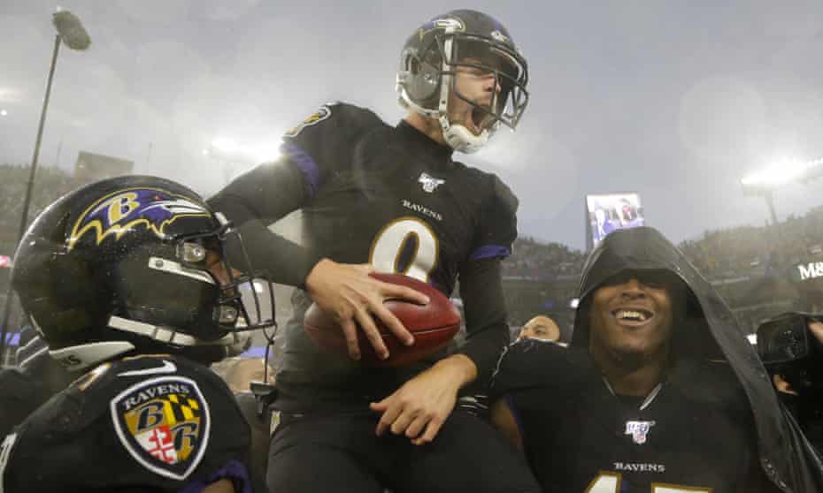 Justin Tucker is carried off the field by his teammates after making a game-winning field goal against the San Francisco 49ers last season