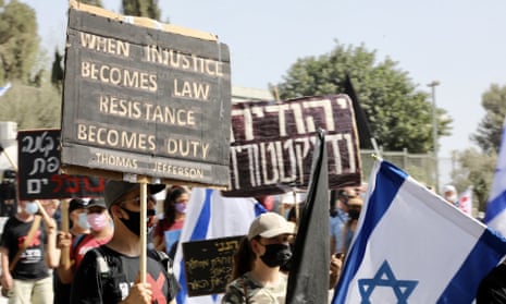 People gather in front of the Israeli parliament to protest against the decision to curb mass rallies.
