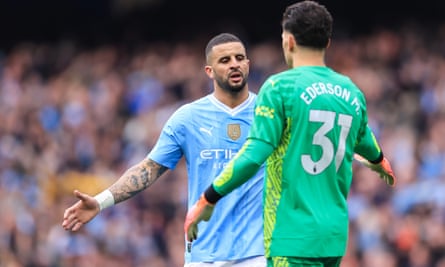 Kyle Walker and Ederson enjoy the rout of Wolves at the Etihad in May.