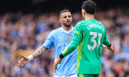 Kyle Walker and Ederson enjoy the rout of Wolves at the Etihad in May.