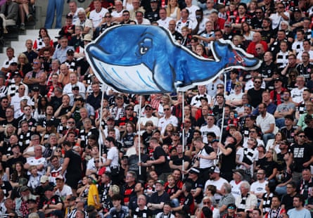 Fans of Eintracht Frankfurt display a banner dedicated to Timmy the humpback whale.