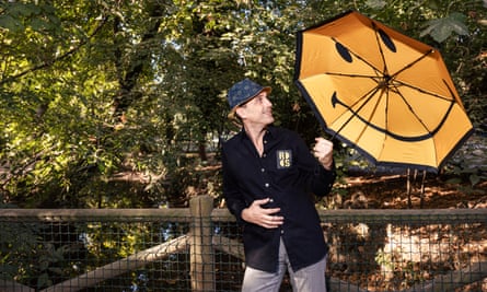 Nicolas Loufrani, CEO of the Smiley Company, photographed in Milan holding an umbrella with a smiley symbol on it