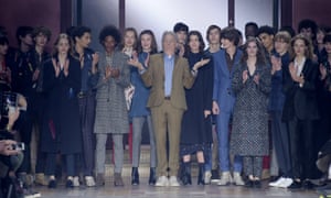 Paul Smith accepts the applause of the crowd at the end of his unisex catwalk show.