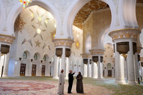 Keir Starmer listening to Sheikh Zayed Grand Mosque's director general Yousef al-Obaidli and a tour guide during a visit to the shrine in Abu Dhabi earlier today.